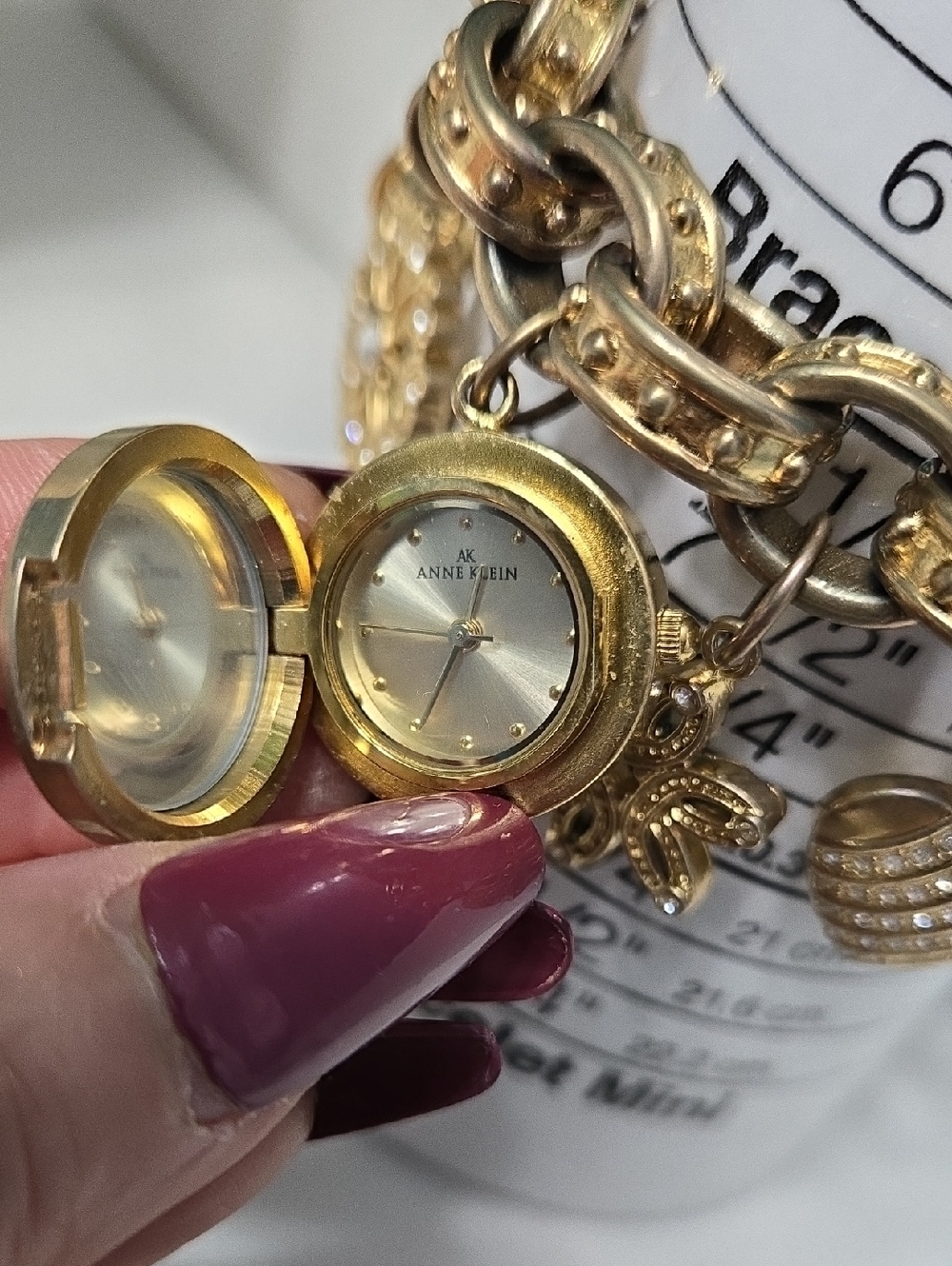 Anne Klein Vintage Gold Tone Charm Bracelet with Heart Watch & Floral Charms - Picture 12 of 15